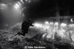 Inside the hull of the Tabarka in Scapa Flow.  The diver ... by Pete Devereux 